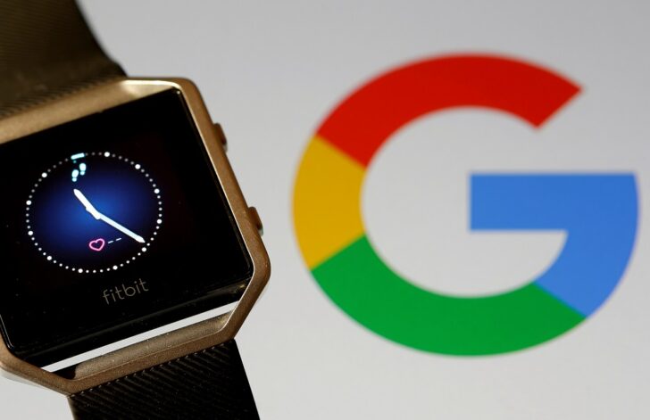 FILE PHOTO: FILE PHOTO: Fitbit Blaze watch is seen in front of a displayed Google logo in this illustration