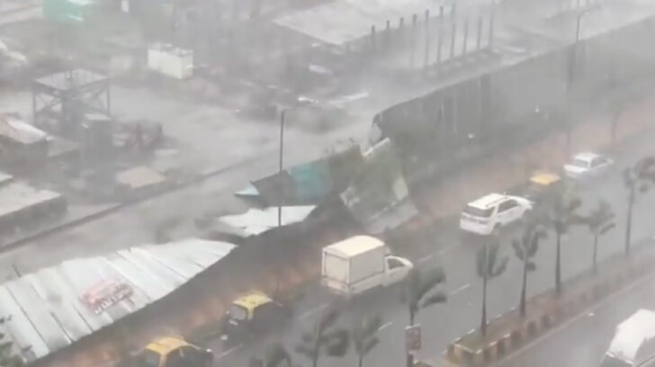 Winds and heavy rain knock down a metal wall due to Cyclone Tauktae in Mumbai