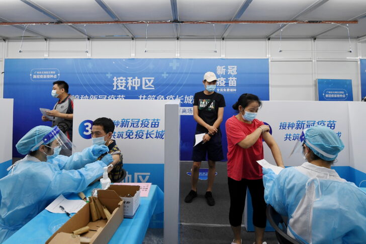 Residents receive vaccines against the coronavirus disease (COVID-19) at a makeshift vaccination site in Guangzhou, Guangdong