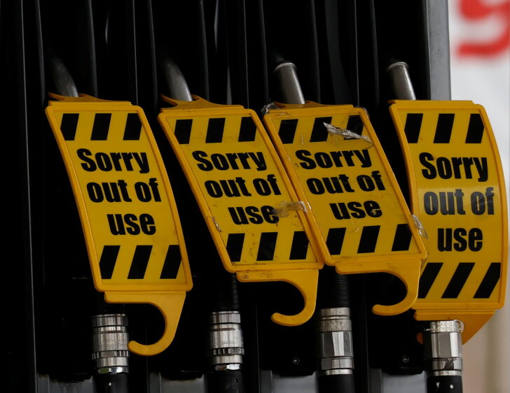 Out of use labels are attached to nozzles on an empty fuel pump at a BP filling station in Manchester