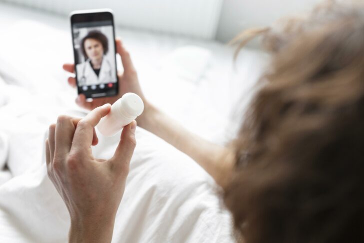 sick-man-having-video-call-with-doctor