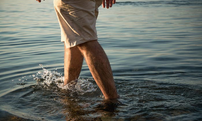 Man walks in the water