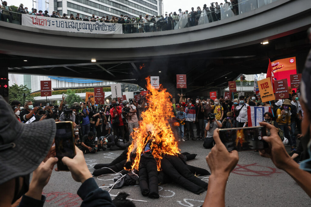 Burning the Phra Phum Shrine with a replica