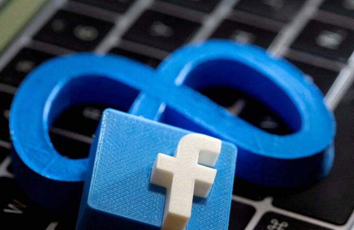 FILE PHOTO: A 3D-printed logo of Facebook sits atop logo of Facebook parent Meta in this photo illustration