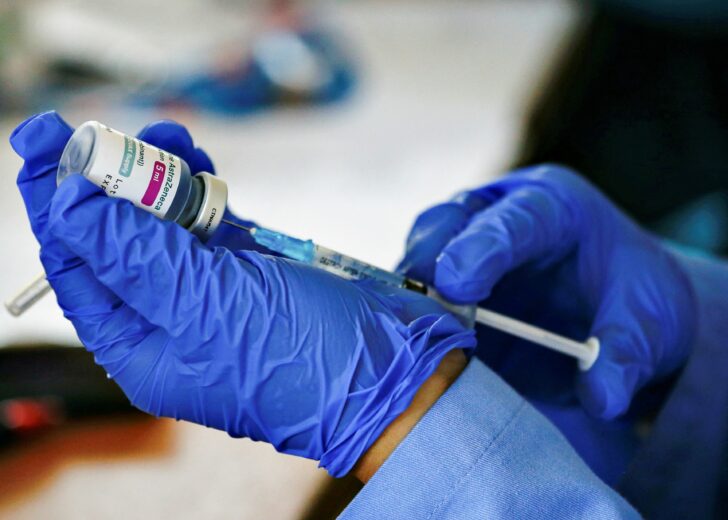 FILE PHOTO: A healthcare worker prepares a dose of the AstraZeneca coronavirus disease (COVID-19) vaccine at a kindergarten in Jakarta