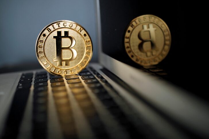 A bitcoin representation is seen in an illustration picture taken at La Maison du Bitcoin in Paris ราคาบิตคอยน์วันนี้ (22 พ.ค. 65)