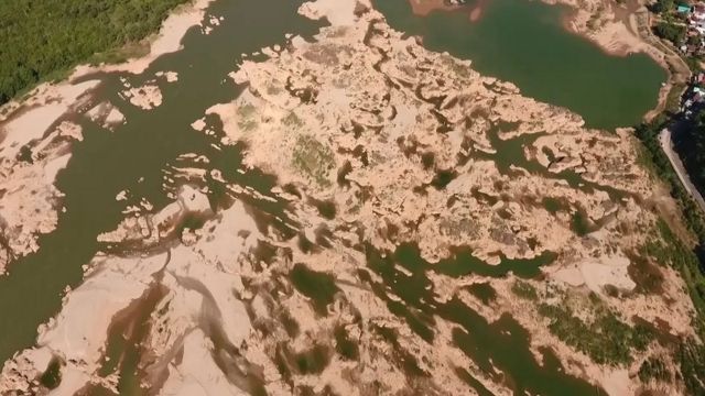 This screengrab from an aerial video taken on October 28, 2019 shows the Mekong river in Sungkom district in Nong Khai province, more than 300km from the Xayaburi dam