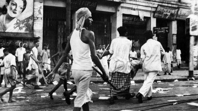 A young man with a weapon in the streets of Kolkata (Calcutta) during the Calcutta Killing of 1946, when an estimated 2,000 people died.