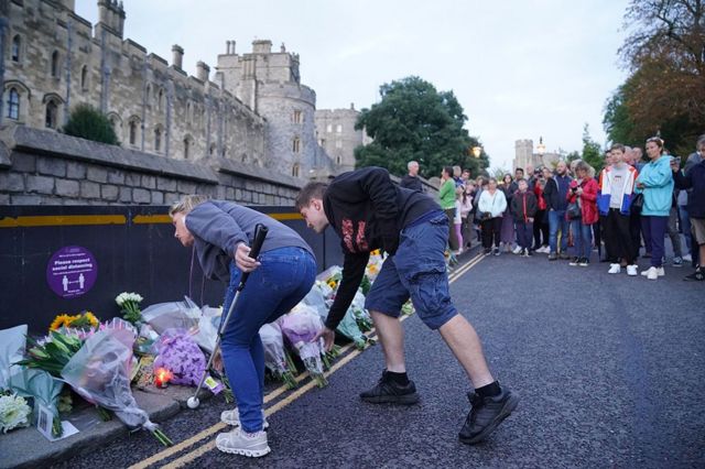 Mourners gather laying flowers outside Windsor Castle