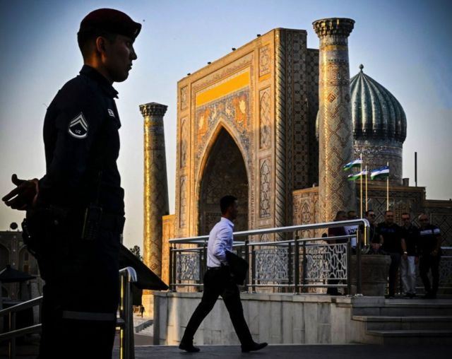 A police officer guards the Registan square in downtown Samarkand on September 13, 2022.