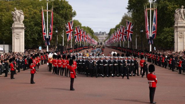 The Queen's coffin travels along the Mall in London