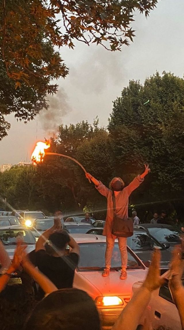 Woman burning a hijab