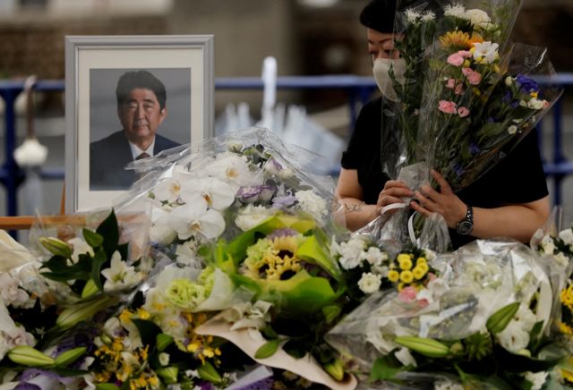 Mourners gather at the altar for the late former Japanese Prime Minister Shinzo Abe