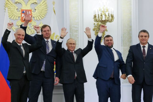 Russian President Vladimir Putin and Denis Pushilin, Leonid Pasechnik, Vladimir Saldo, Yevgeny Balitsky, who are the Russian-installed leaders in Ukraine's Donetsk, Luhansk, Kherson and Zaporizhzhia regions