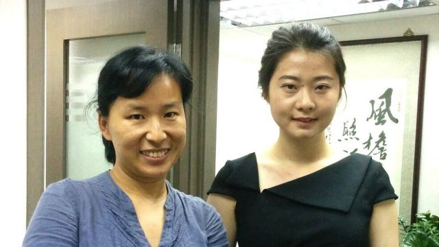 Geng He (L) today with her daughter Grace