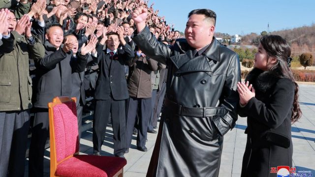 Kim Jong-un and his daughter with North Korean military personnel