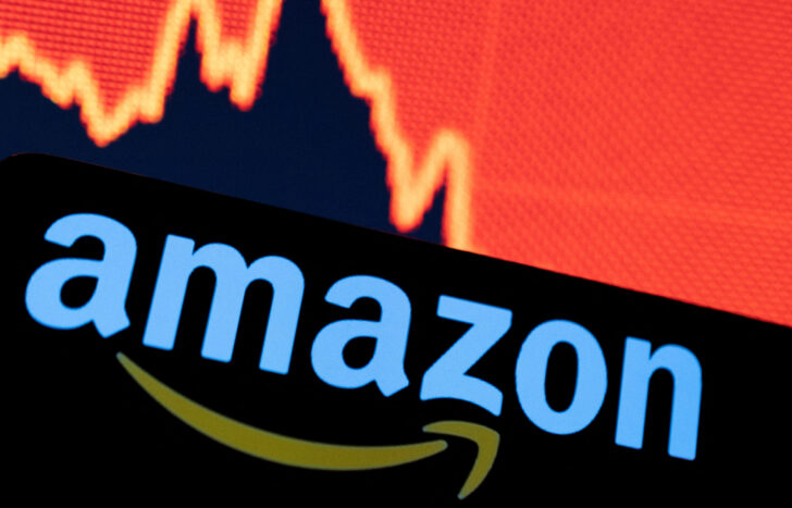 FILE PHOTO: Illustration shows Amazon logo and a decreasing stock graph