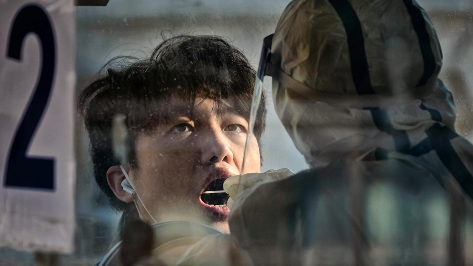 A man takes Coronavirus PCR test at the Shanghai Railway Station