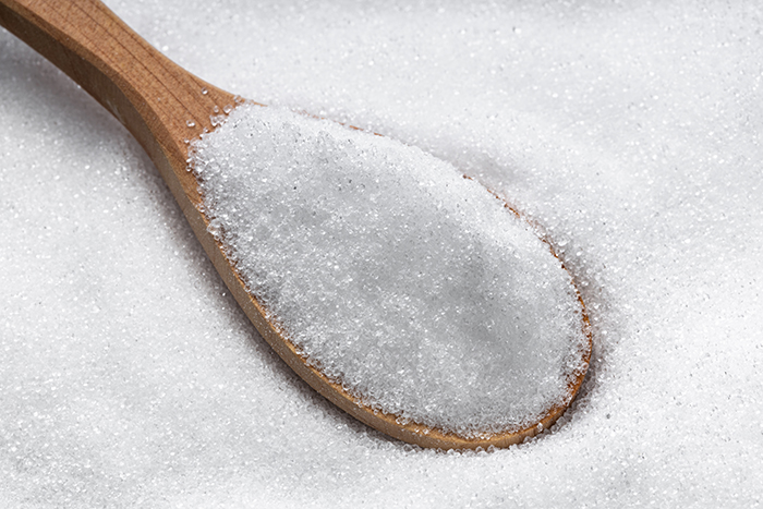wooden spoon with crystalline erythritol sugar น้ำตาลทราย