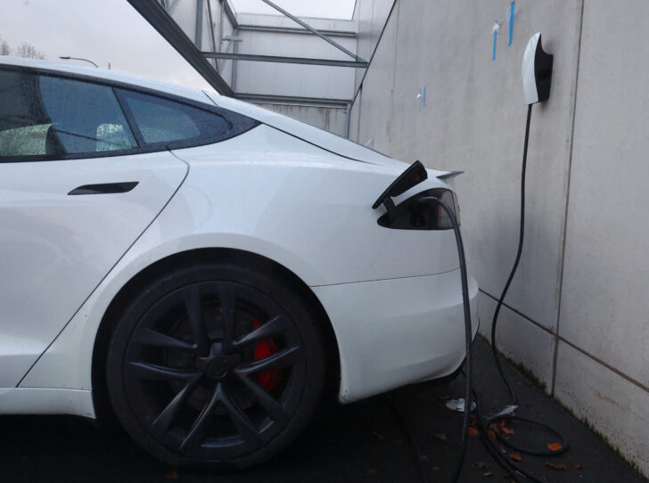 A Tesla electric vehicles is being charged at a charging station outside a dealership in Drogenbos Tesla