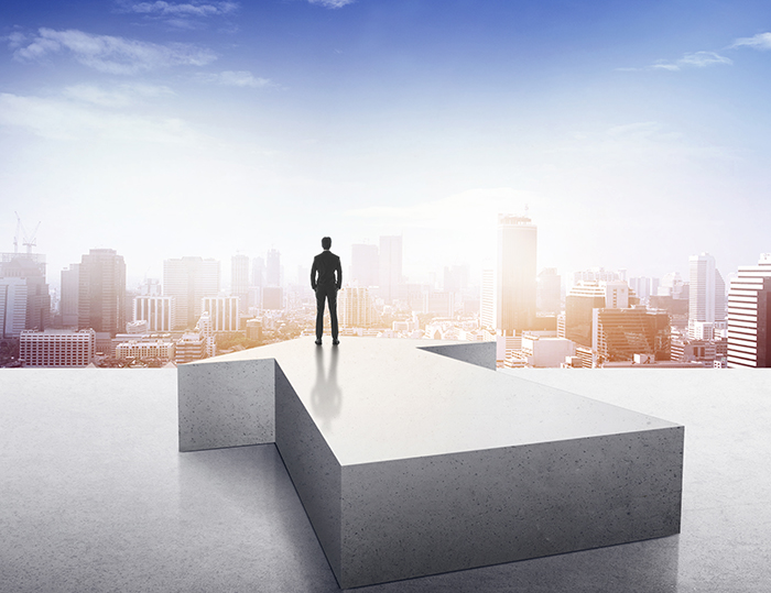 Vision concept. Successful businessman standing on arrow and loo