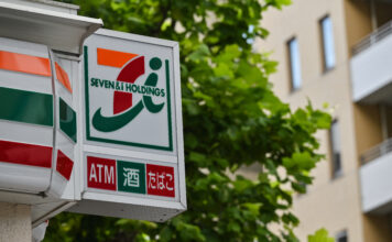 A sign for a 7-Eleven convenience store (Photo by Richard A. Brooks / AFP)