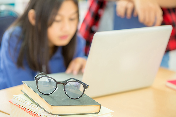 student studying in the school library