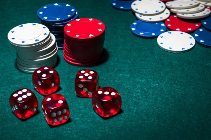 red-dices-stack-gambling-chips-green-poker-table red-dices-stack-gambling-chips-green-poker-table