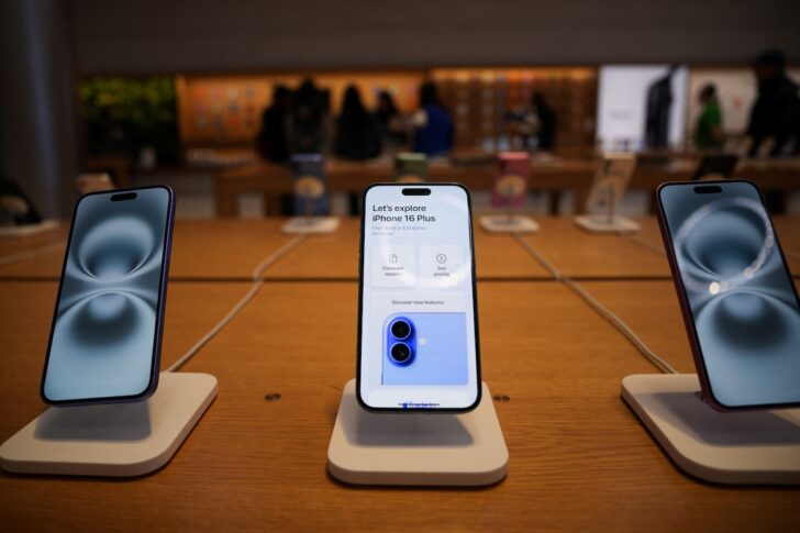 People visit Apple's Fifth Avenue store in New York City