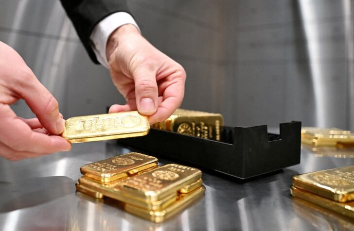 FILE PHOTO: Gold bars and coins in the safe at Pro Aurum gold house in Munich FILE PHOTO: Gold bars and coins in the safe at Pro Aurum gold house in Munich
