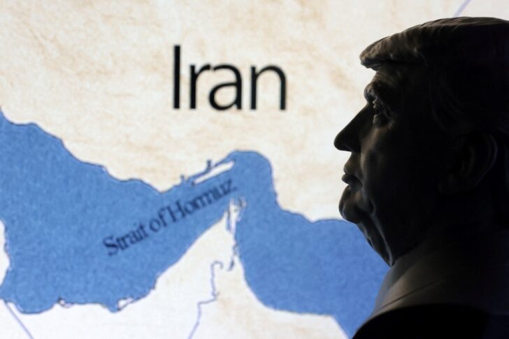 Illustration shows map showing the Strait of Hormuz, Iran and 3D printed miniature of U.S. president Donald Trump Illustration shows map showing the Strait of Hormuz, Iran and 3D printed miniature of U.S. president Donald Trump