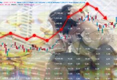 Businessman grabs the head concept.Stock Market - Arrow Graph red Going Down.